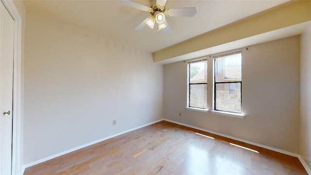 spare room with ceiling fan and light hardwood / wood-style floors