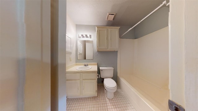 full bathroom featuring tile patterned flooring, vanity, a textured ceiling, shower / bathtub combination, and toilet