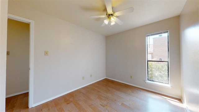 spare room featuring ceiling fan and light wood-type flooring