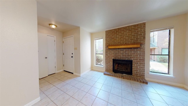 unfurnished living room featuring light tile patterned flooring and a fireplace