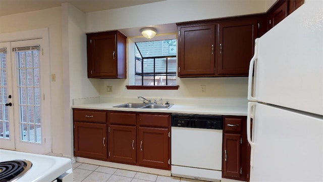 kitchen featuring sink, white appliances, french doors, and light tile patterned floors