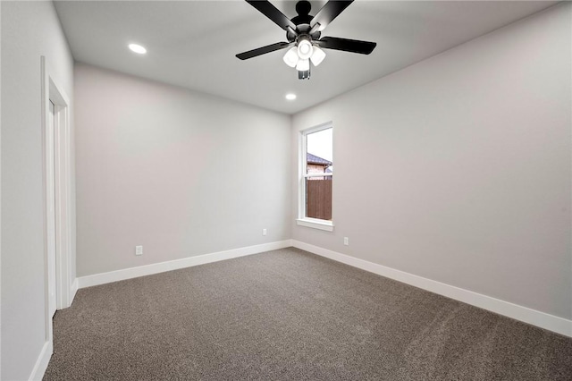 unfurnished room featuring ceiling fan and carpet flooring