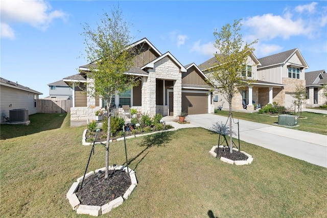 craftsman inspired home featuring a front yard and a garage