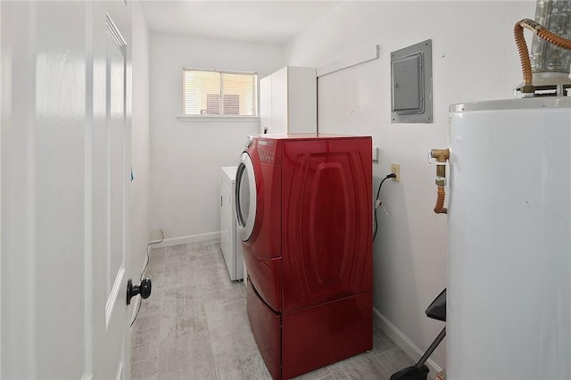 laundry area with water heater, washing machine and dryer, baseboards, and electric panel