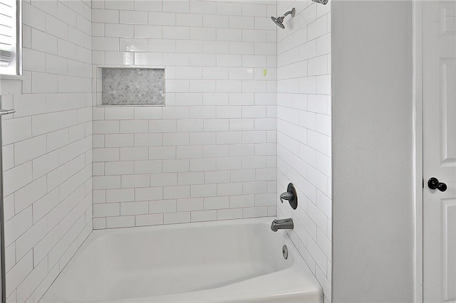 bathroom with shower / tub combination