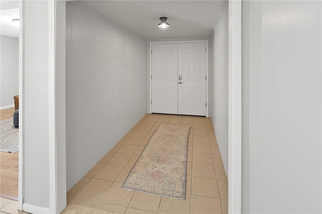 hall with light tile patterned floors