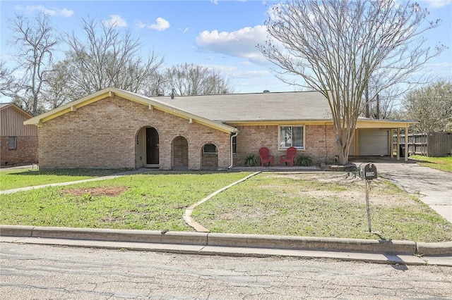 view of front of home featuring brick siding, a front lawn, concrete driveway, and an attached garage