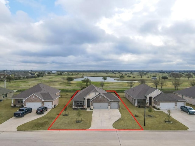 drone / aerial view featuring a water view