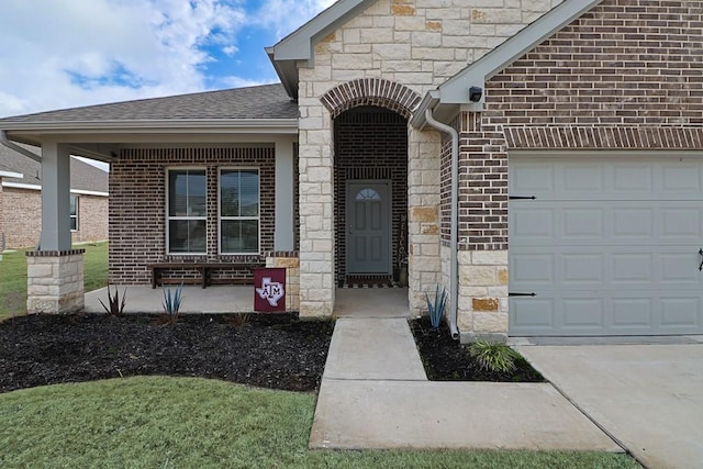 doorway to property with a garage