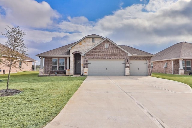 view of front facade with a garage and a front lawn