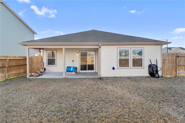 rear view of property featuring a patio