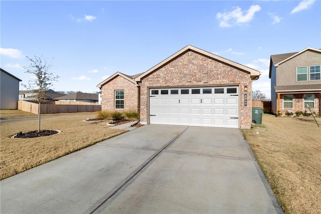 single story home with a garage and a front yard