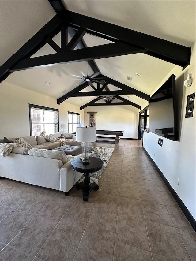 unfurnished living room featuring lofted ceiling with beams