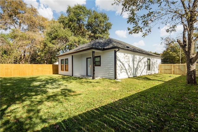 view of outbuilding featuring a lawn