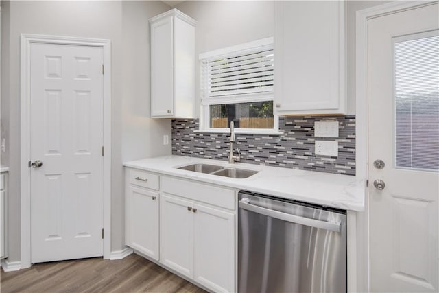 507 Brosig Ave, Navasota, TX 77868 - kitchen featuring dishwasher, backsplash, light wood-style flooring, white cabinets, and plenty of natural light