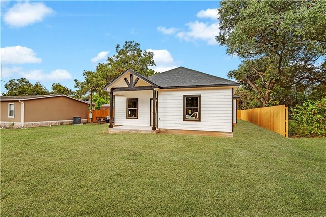 view of outbuilding featuring a yard