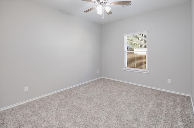 unfurnished room featuring ceiling fan and light colored carpet