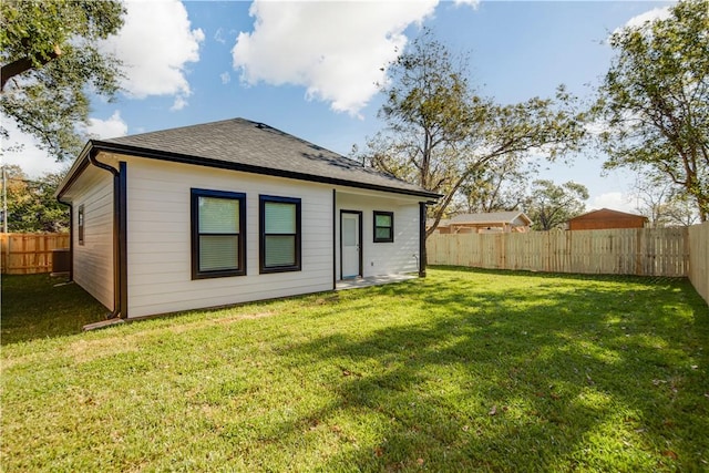 507 Brosig Ave, Navasota, TX 77868 - back of property with a fenced backyard and roof with shingles