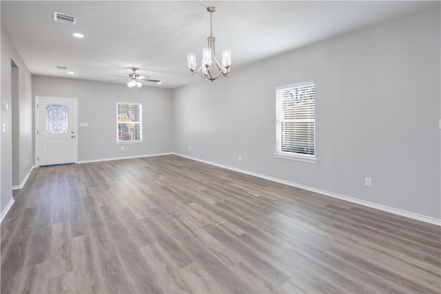 507 Brosig Ave, Navasota, TX 77868 - spare room with ceiling fan, a chandelier, wood finished floors, and recessed lighting