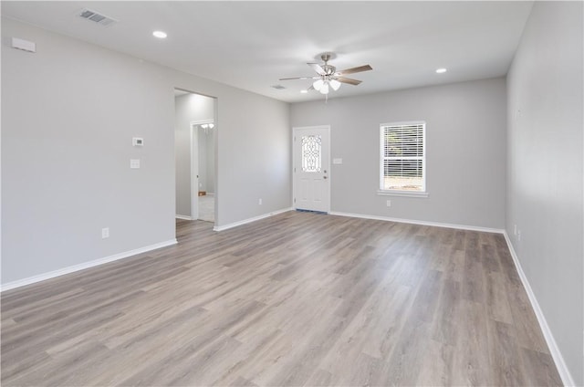 507 Brosig Ave, Navasota, TX 77868 - unfurnished living room with a ceiling fan, light wood-type flooring, and recessed lighting