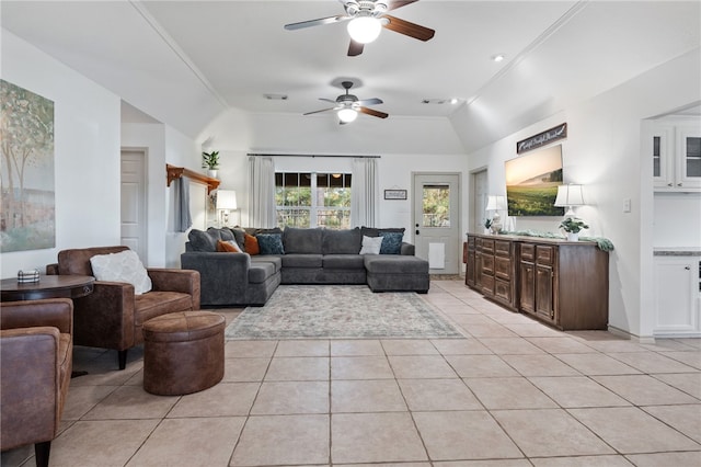 tiled living room with vaulted ceiling and ceiling fan