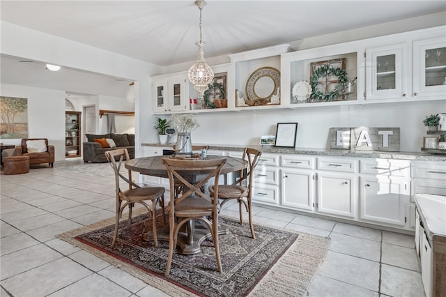 dining area with light tile patterned flooring