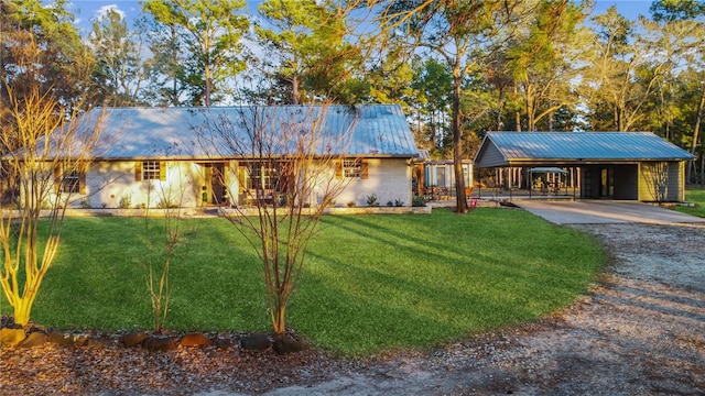 ranch-style house with a carport and a front yard