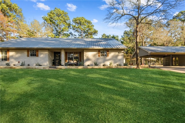 back of property featuring a lawn