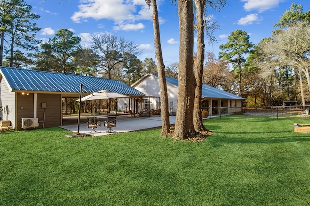 view of yard with ac unit and a patio area