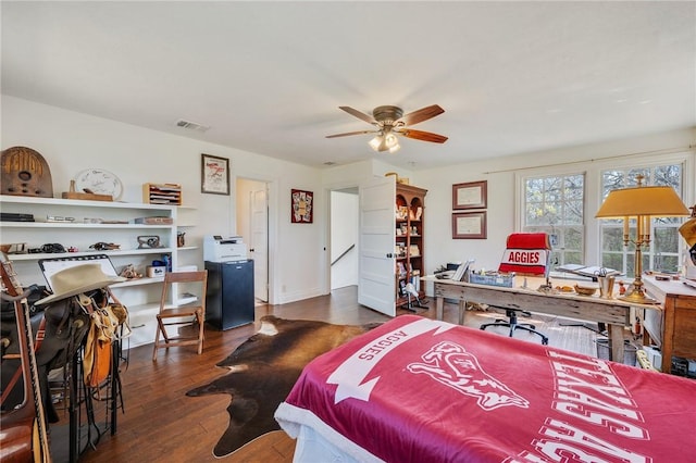 bedroom featuring visible vents, a ceiling fan, and hardwood / wood-style floors