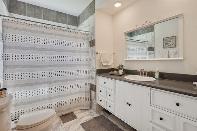 bathroom with vanity, curtained shower, toilet, and marble finish floor