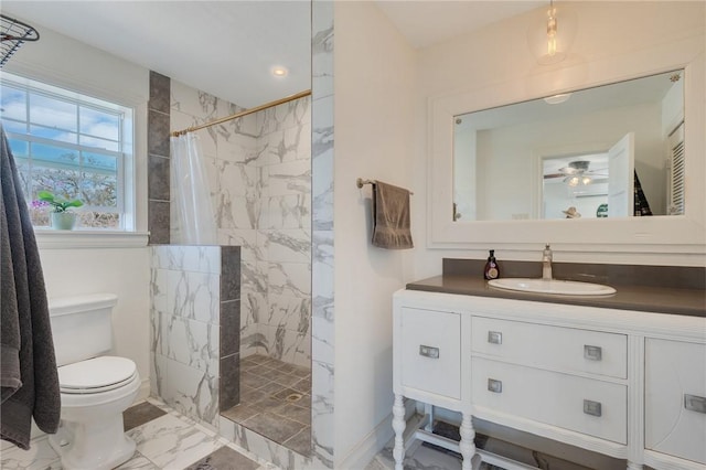 full bathroom with vanity, ceiling fan, a walk in shower, toilet, and marble finish floor