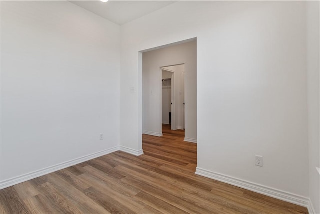 spare room with hardwood / wood-style flooring