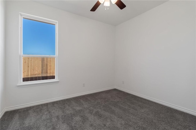 carpeted empty room featuring ceiling fan