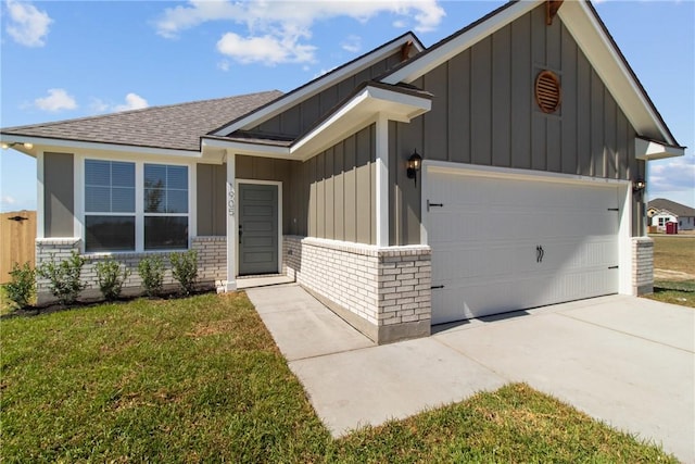 view of front facade with a garage and a front lawn