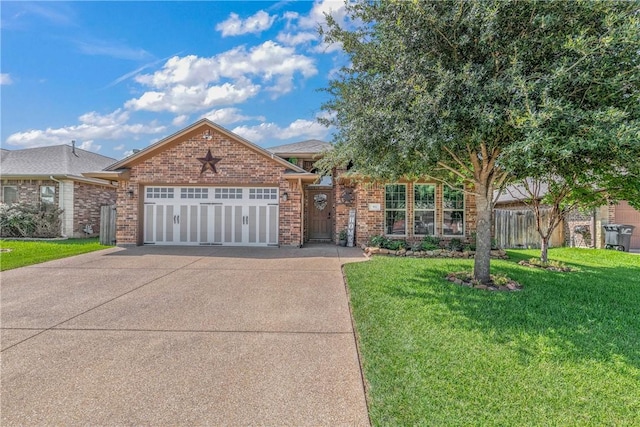 view of front of house featuring a front lawn and a garage