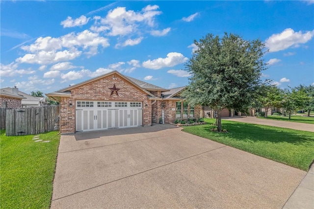 view of front of property with a garage and a front yard