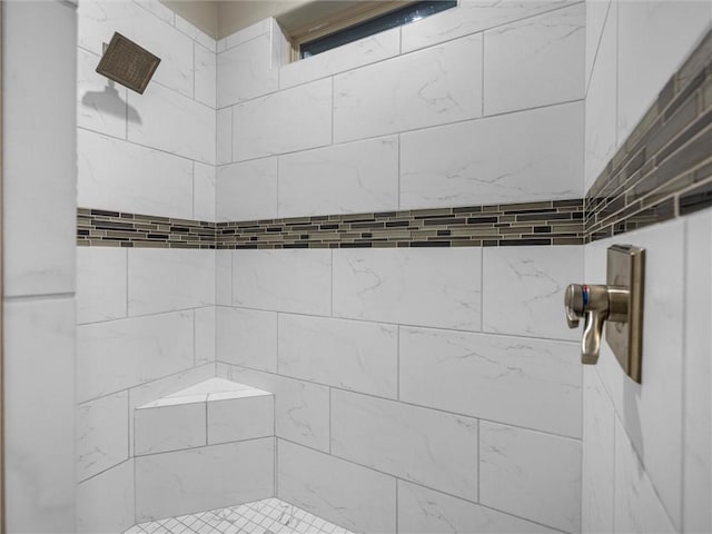 bathroom with a tile shower