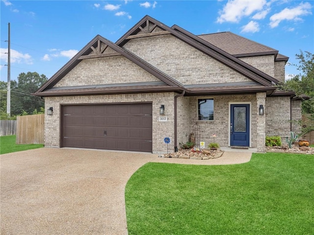 view of front of house featuring a garage and a front yard