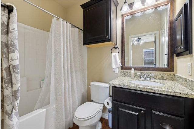 full bathroom with toilet, shower / bath combo with shower curtain, and vanity