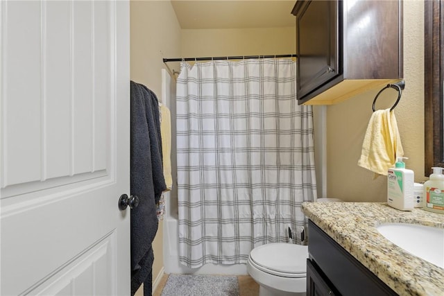 full bathroom featuring shower / bath combination with curtain, vanity, and toilet