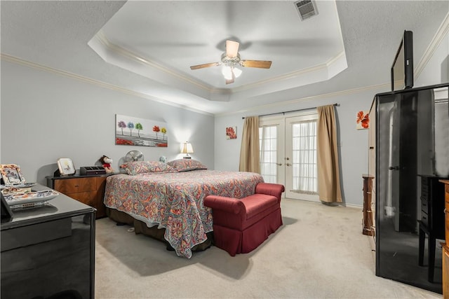 3003 Aztec St, College Station, TX 77845 - bedroom featuring a tray ceiling, ornamental molding, french doors, light colored carpet, and a ceiling fan