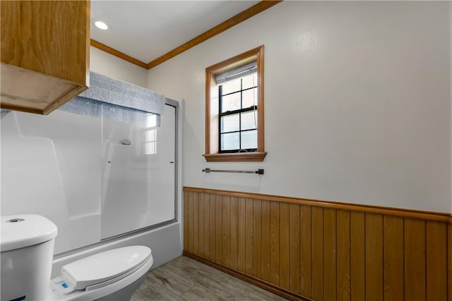 3003 Aztec St, College Station, TX 77845 - full bathroom with toilet, a wainscoted wall, crown molding, bath / shower combo with glass door, and wooden walls