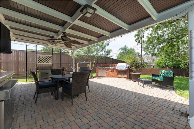 3003 Aztec St, College Station, TX 77845 - fenced backyard with a patio area, outdoor dining area, and a ceiling fan