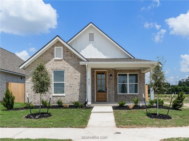 view of front of house featuring a front yard and a porch