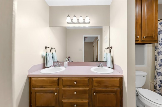 2306 Windsor Dr, Bryan, TX 77802 - full bath with double vanity and toilet