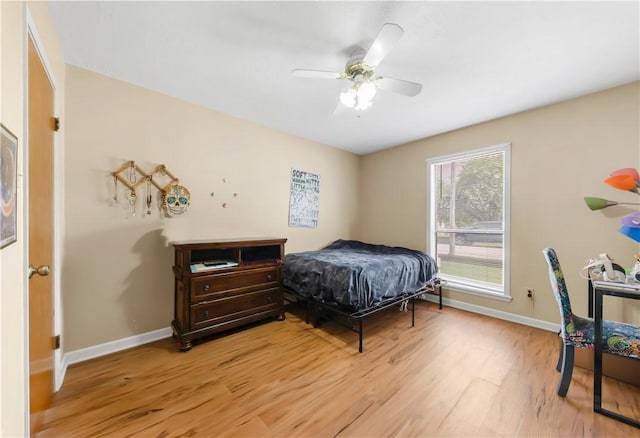 2306 Windsor Dr, Bryan, TX 77802 - bedroom featuring light wood finished floors and a ceiling fan