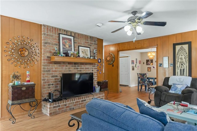 2306 Windsor Dr, Bryan, TX 77802 - living area featuring wood finished floors, a ceiling fan, and wood walls