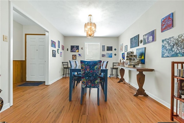 2306 Windsor Dr, Bryan, TX 77802 - dining room with light wood-type flooring and a chandelier