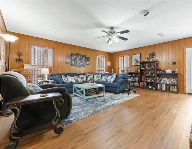 2306 Windsor Dr, Bryan, TX 77802 - living area with ceiling fan, wood finished floors, and wooden walls